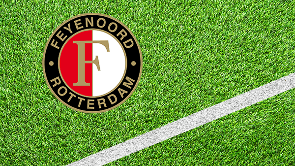 Logo voetbalclub Rotterdam - Feyenoord Rotterdam - in kleur op grasveld met witte lijn - 600 * 337 pixels